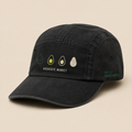 Washed black five-panel camp cap, three-quarter view. Four-stage ripening scale printed on the front panel.