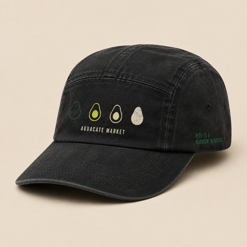 Washed black five-panel camp cap, three-quarter view. Four-stage ripening scale printed on the front panel.
