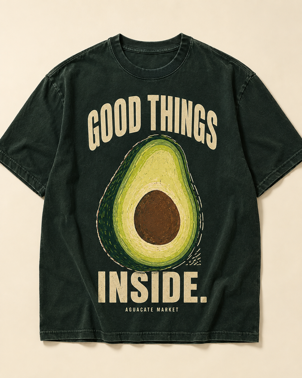 Peel green heavyweight tee, front. GOOD THINGS INSIDE. arched around a cut avocado on the chest.