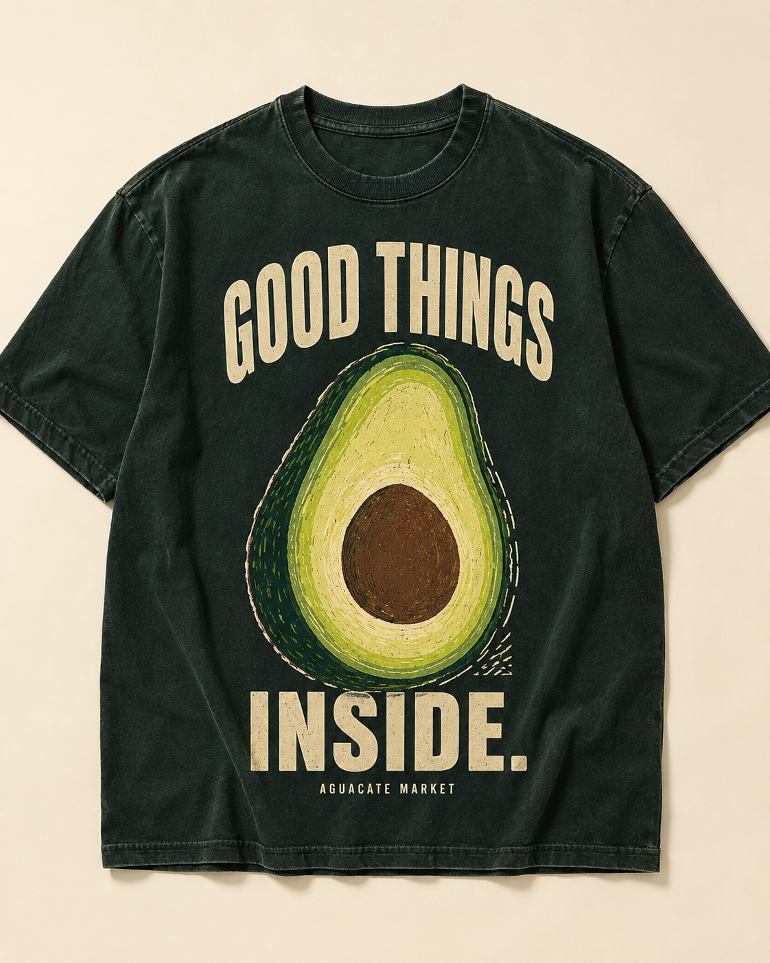 Peel green heavyweight tee, front. GOOD THINGS INSIDE. arched around a cut avocado on the chest.
